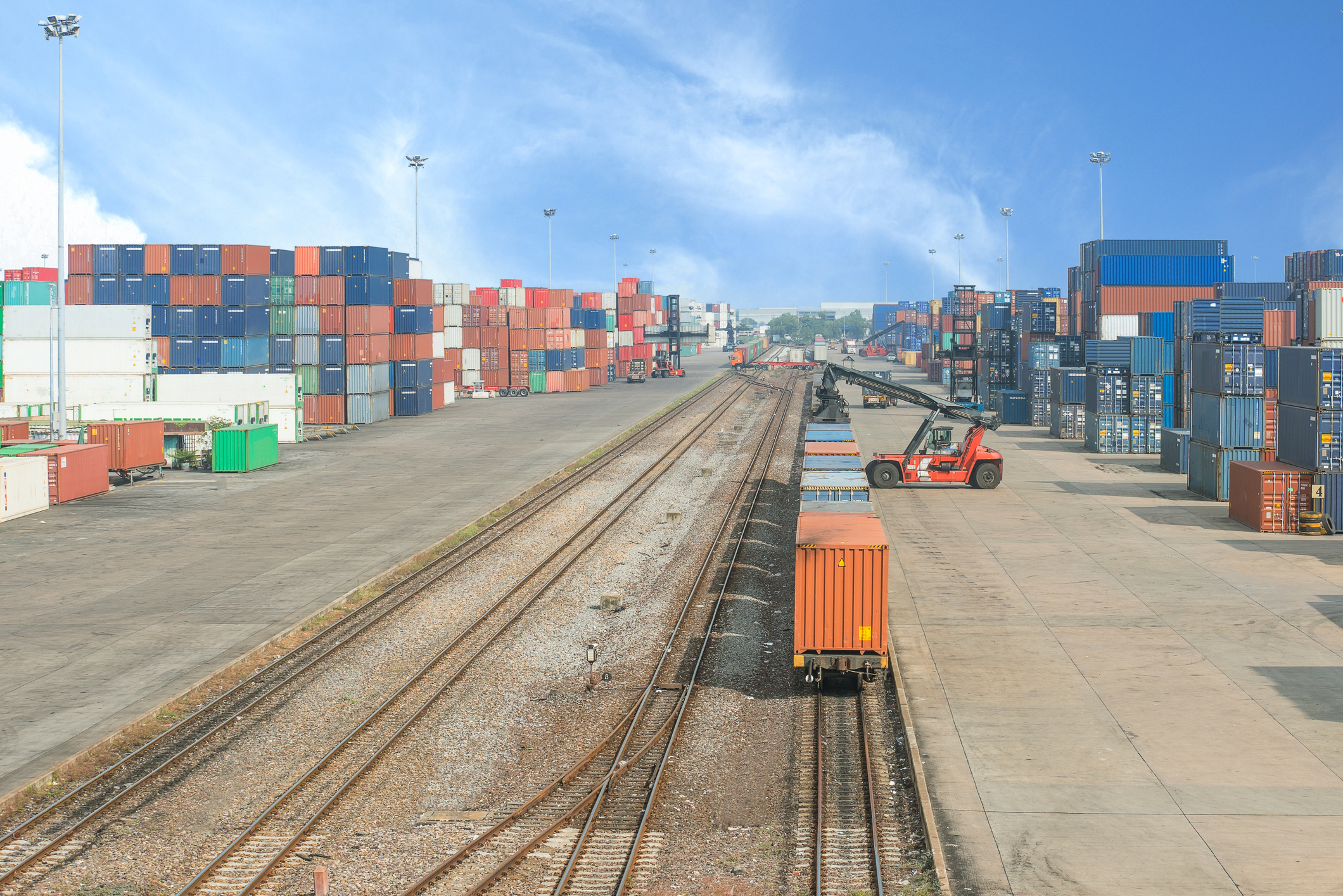 Loading intermodal rail cars at a terminal.