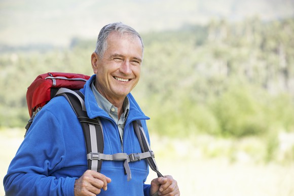 Senior man backpacking