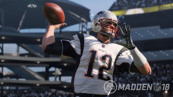 Screenshot from Madden NFL 18 video game showing a quarterback throwing a football.