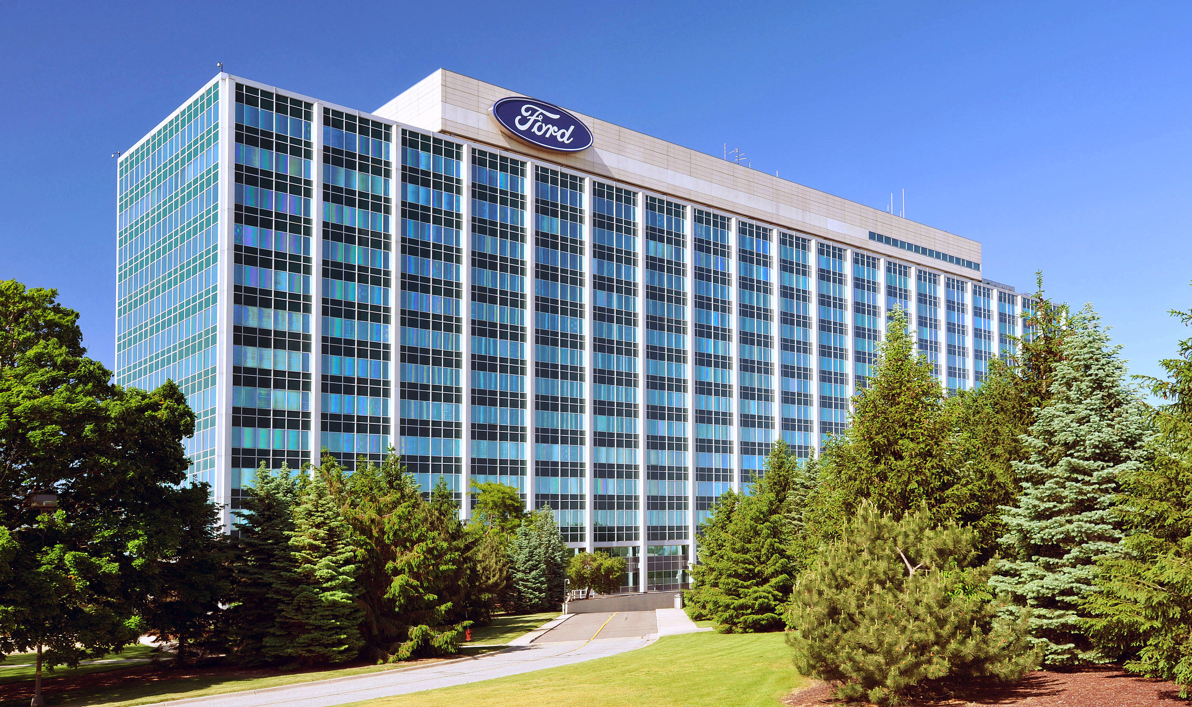 Ford's headquarters building, with part of its front lawn visible