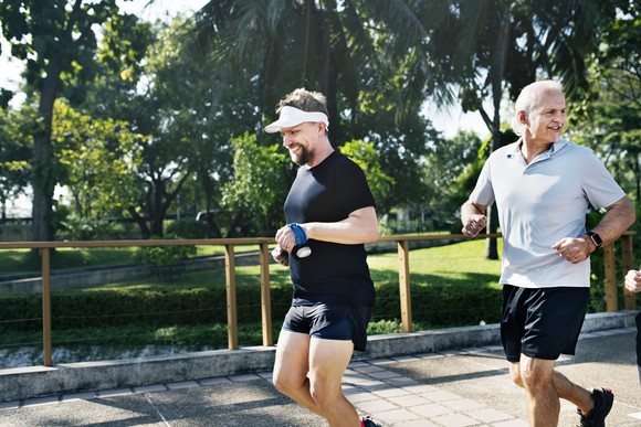 Two men jogging in the park.