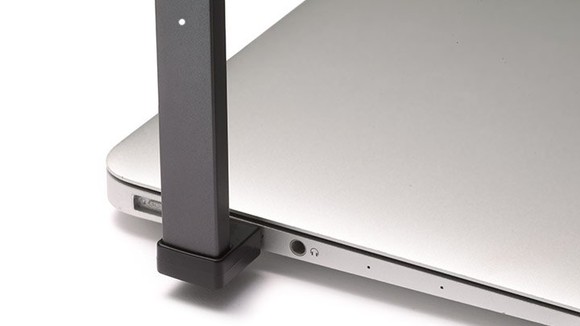 JUUL e-cig device plugged into laptop USB port