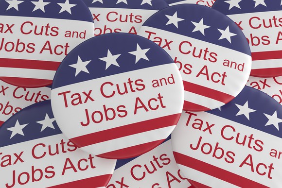 Pile of buttons reading Tax Cuts and Jobs Act