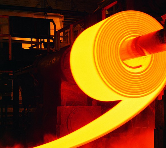 A hot roll of steel in a steel plant.