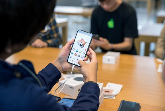 Customer trying Animoji on iPhone X