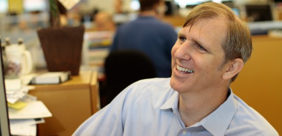 Robert Brokamp smiling off to the side.