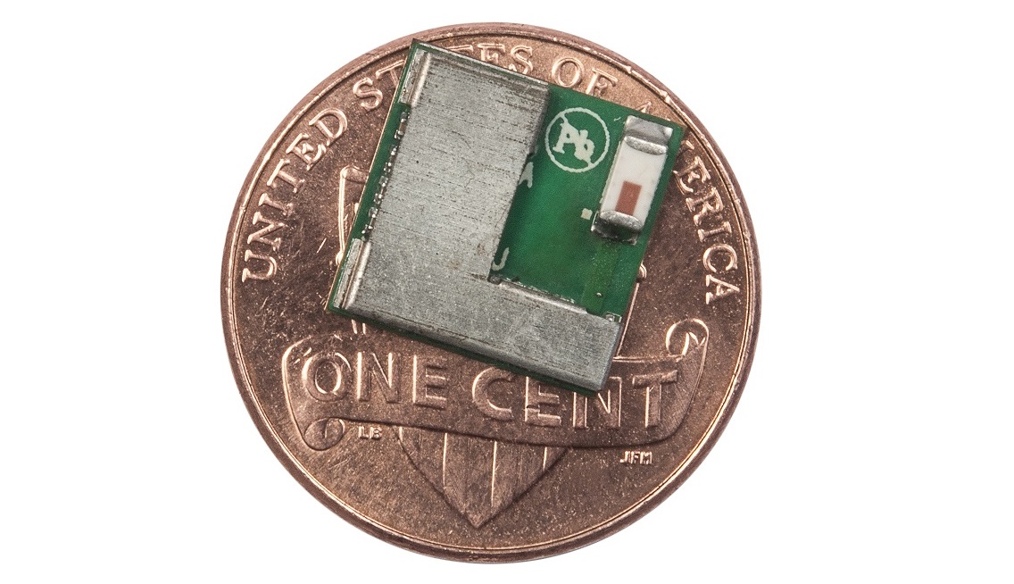 A Cypress Semiconductor Bluetooth chip sitting on a penny