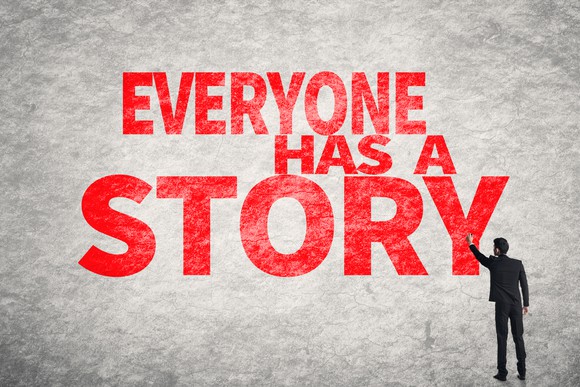 Business man write words on wall, Everyone Has a Story