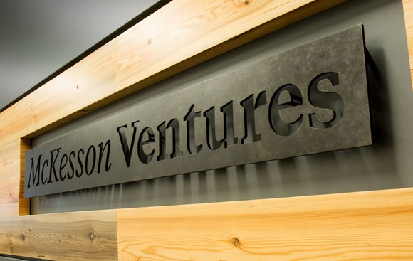 Metal sign framed in wood saying McKesson Ventures.