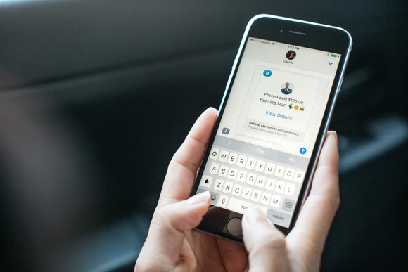 Close-up of user sending money with Venmo on mobile device.