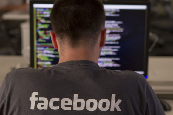 A Facebook engineer writing computer code.