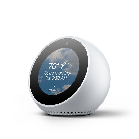 A white Amazon Echo Spot, which is a round or oval shape.