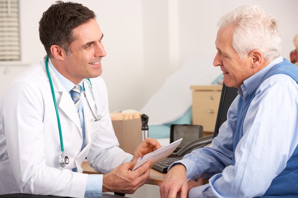 Doctor talking to a senior man