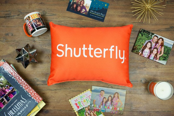 An assortment of photo-based mugs, prints, books, and pillows from Shutterfly.