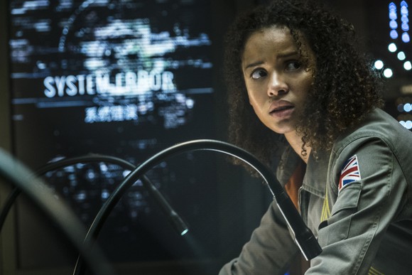 A still from the movie The Cloverfield Paradox, showing a female character with a look of fear and concern.