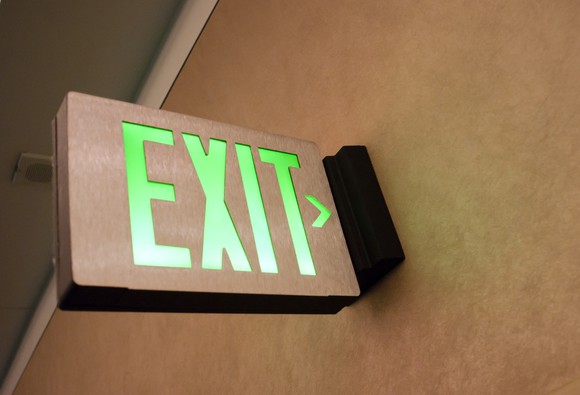 An emergency exit sign illuminated.