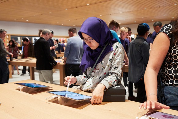 Customer trying iPad Pro at an Apple Store