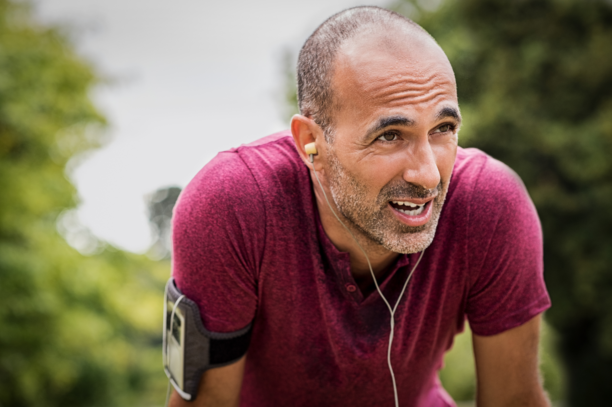 Man with headphones and arm band
