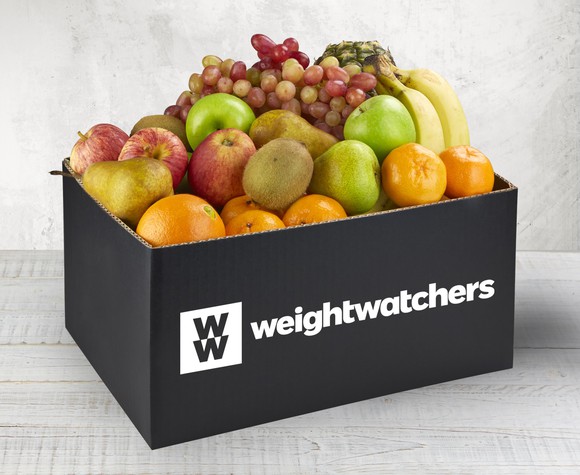 Black box of fruit on table with Weight Watchers logo on it.