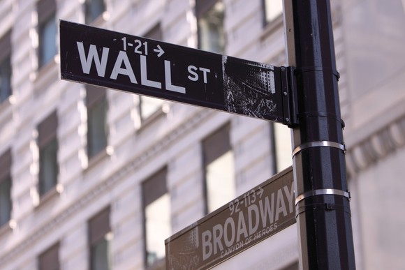 Street sign at intersection of Wall Street and Broadway.
