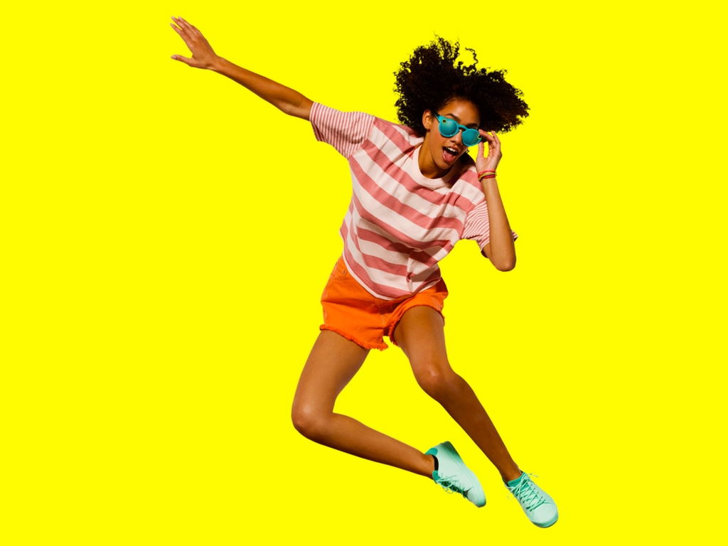 Girl wearing Snap's Spectacles in motion