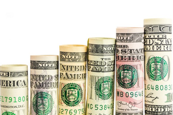 Six rolls of increasing denominations of U.S. currency.