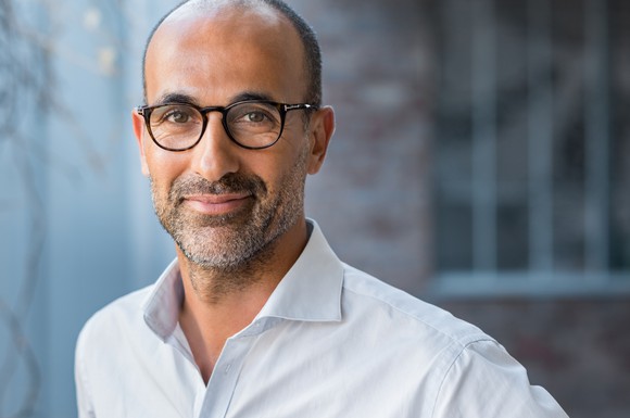 Smiling mid-aged man with glasses