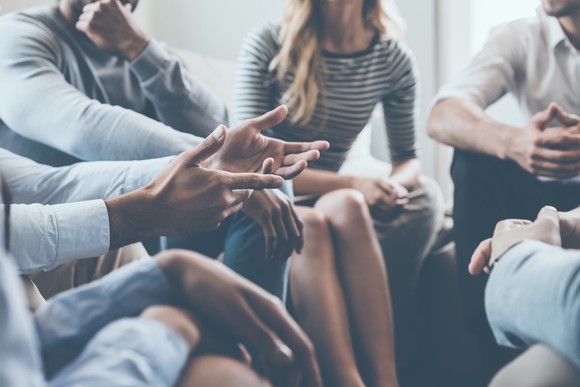 A group of professionals sitting in a circle