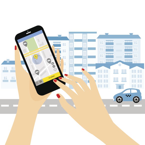 A cartoon woman's fingers pushing a button on a ridesharing app.