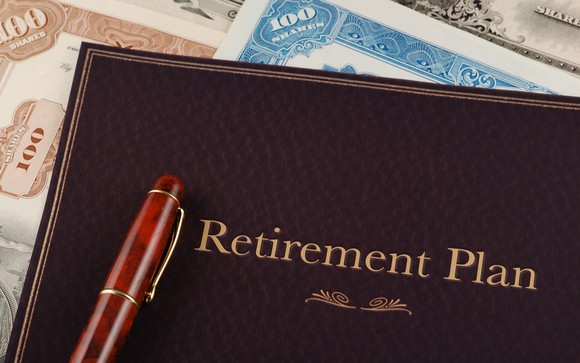 Retirement plan portfolio on top of stock certificates.