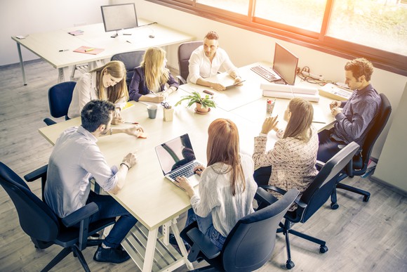 Professionals gathered around a table