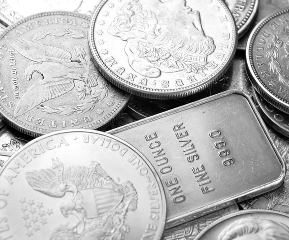 Pile of various silver coins and bullion.