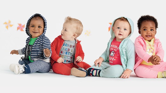Four toddlers wearing Carter's clothing
