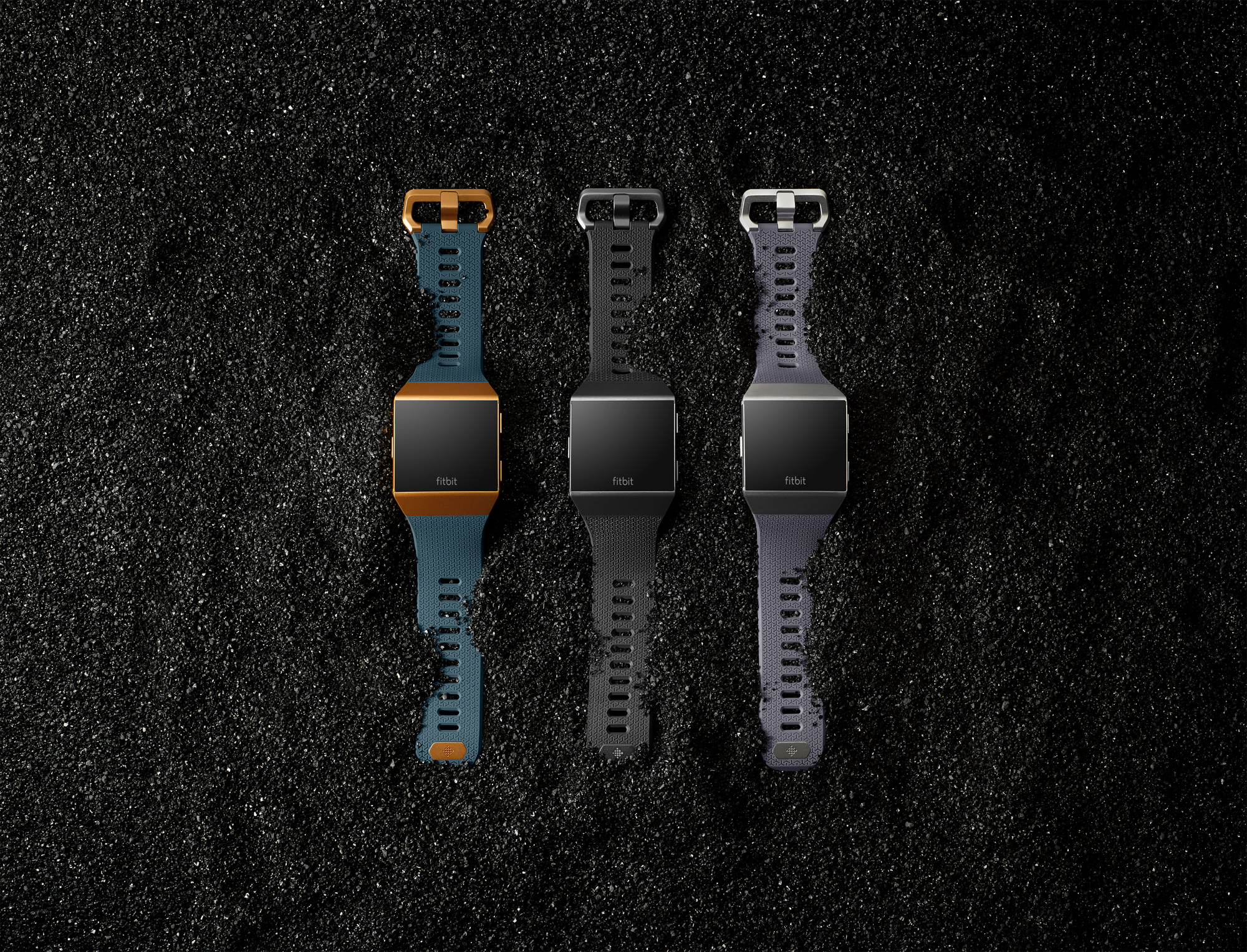 Three Fitbit Ionics on gravel