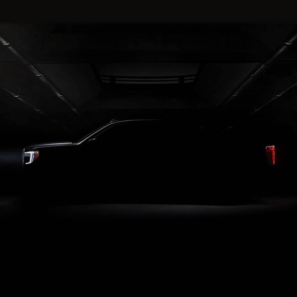 A darkened photo of the side of the 2019 GMC Sierra pickup. Only the truck's general outline is visible.
