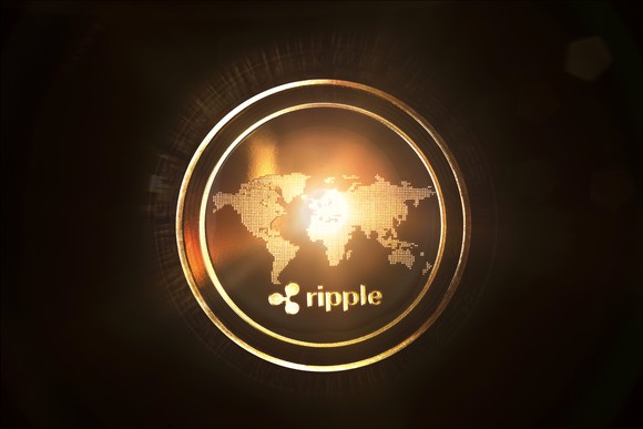 Digital rendering of a gold coin, featuring a world map and the Ripple logo.