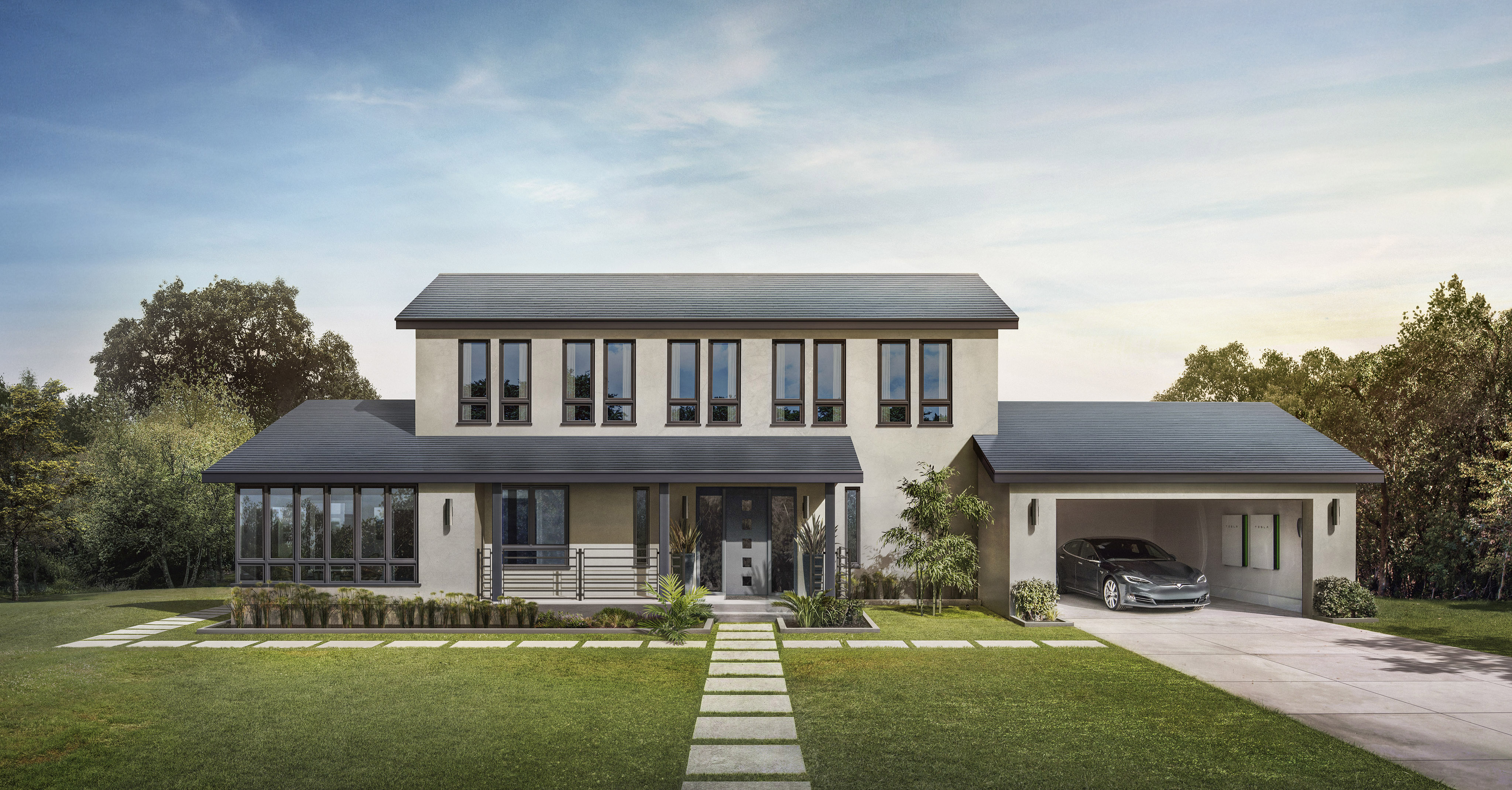 A house with Tesla Smooth Glass solar tiles on the roof and a Model S with two Powerwalls in the garage.