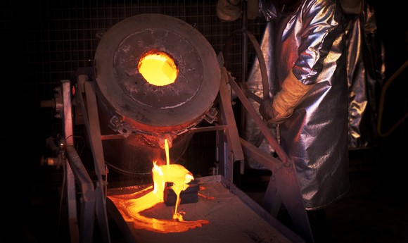 Molten metal being poured out of a foundry.