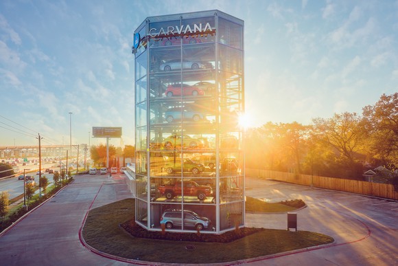 Vehicles parked inside a Carvana's multi-story vending machine concept.