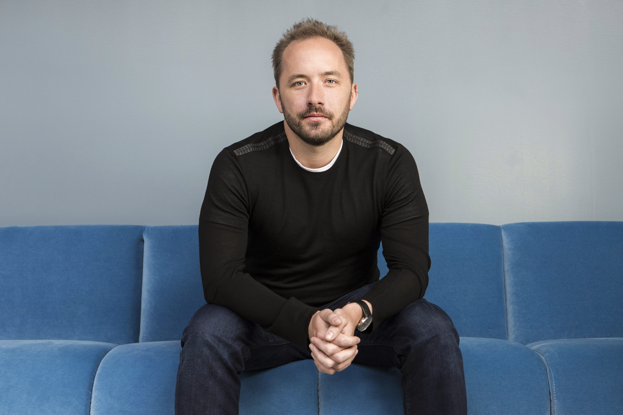 Drew Houston sitting on a couch