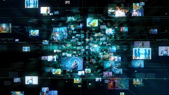 Dozens of screen images emanating from a central point and expanding outwards representing an abstract digital advertising concept.