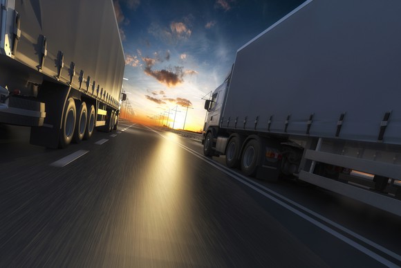 two trucks on a highway