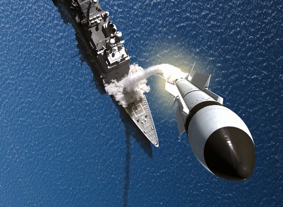 An ariel view of a warship firing a Raytheon missile interceptor.