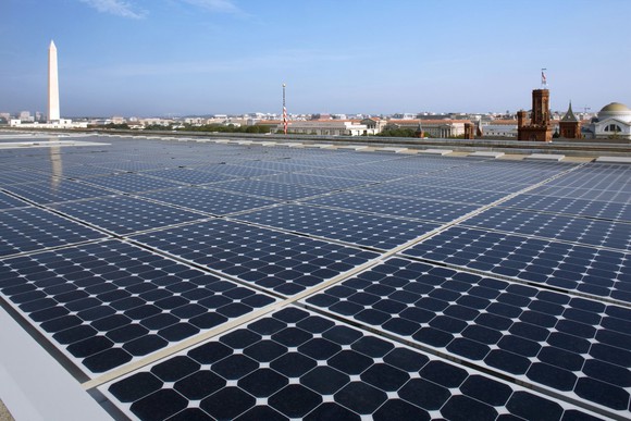 Solar array with the Washington Monument in the background.