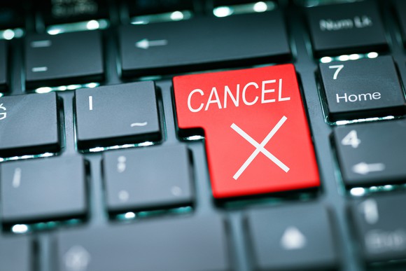 A large red "Cancel" button on a keyboard