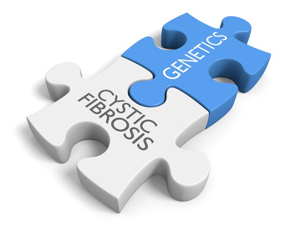 Jigsaw puzzle pieces with cystic fibrosis and genetics printed on them