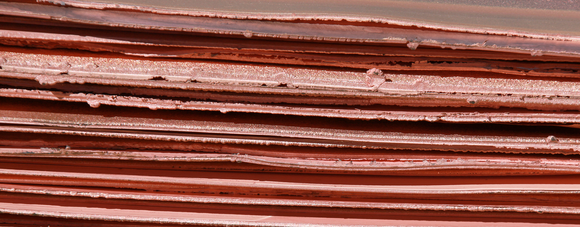 Long thin sheets of copper plate.