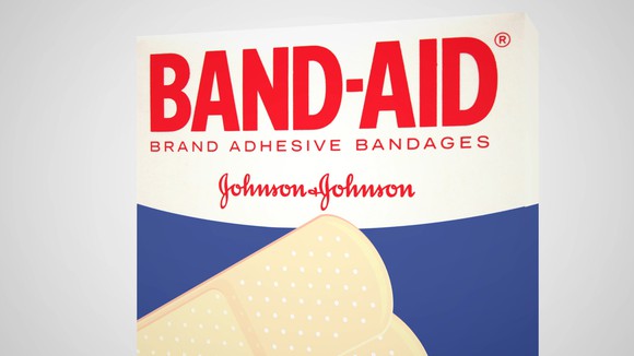 Front of Band-Aid box with red wording on white background and bandages over a blue background.