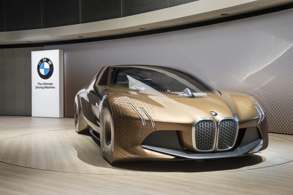The BMW Vision Next 100 show car, a sleek futuristic-looking sedan.
