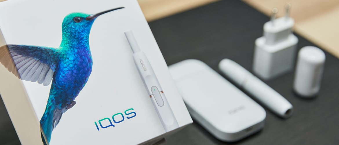 iQOS package, including box, unit, plug, and adaptor.